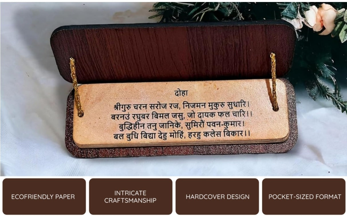 Wooden plaque with engraved text on a white surface with flowers