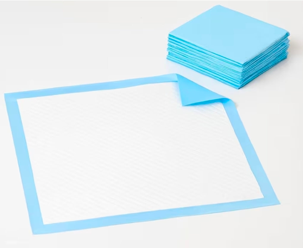 Stack of folded baby pee pads beside one unfolded flat waterproof changing mat with blue border